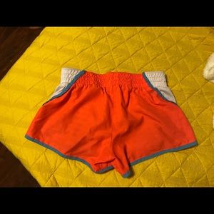 Pink and white Nike shorts